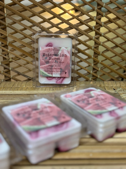 Watermelon burst wax melts on a woven surface