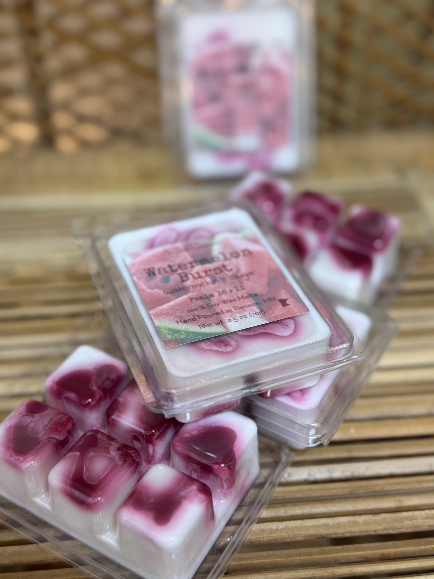Wax melts with a watermelon burst flavor on a wooden surface. Home fragrance.