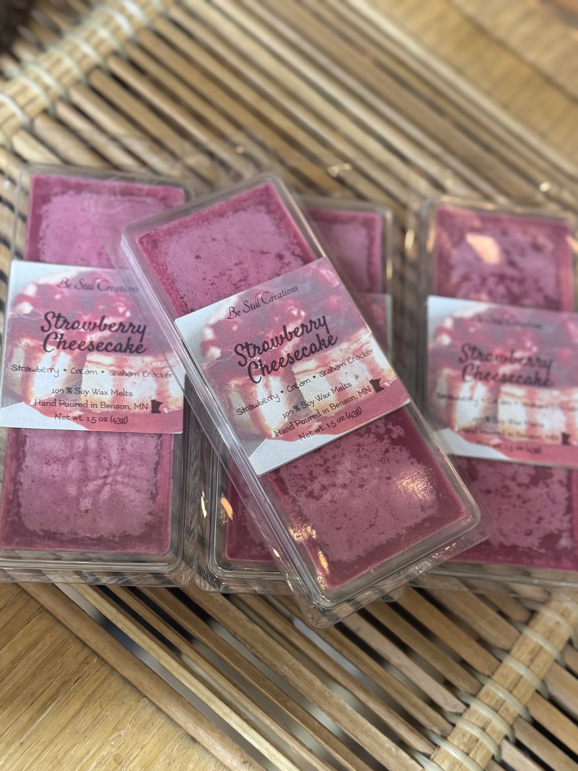 Strawberry Cheesecake wax melts packaging on a woven mat