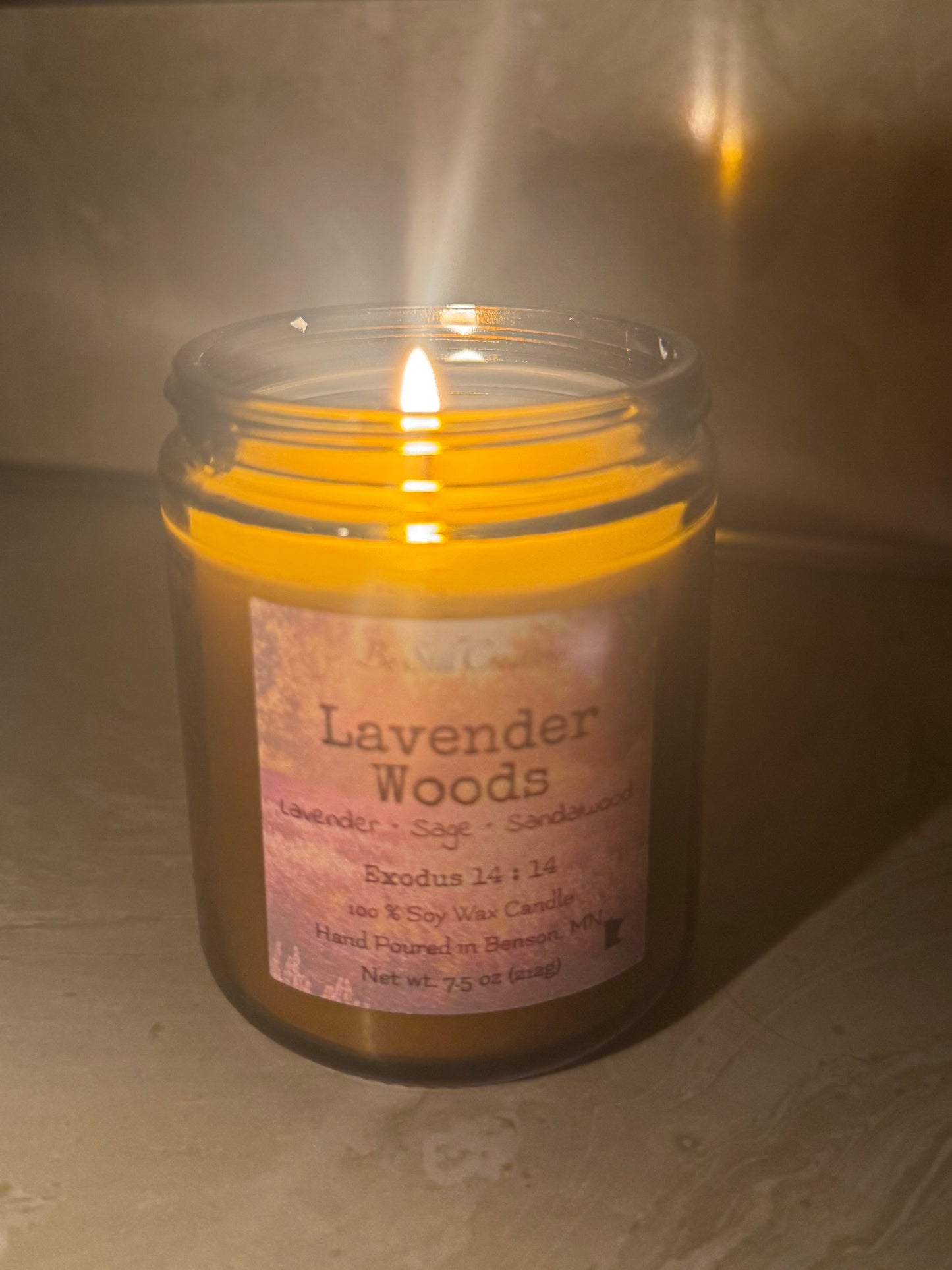 Close-up of Lavender Woods candle label showing lavender, sage, and sandalwood fragrance notes