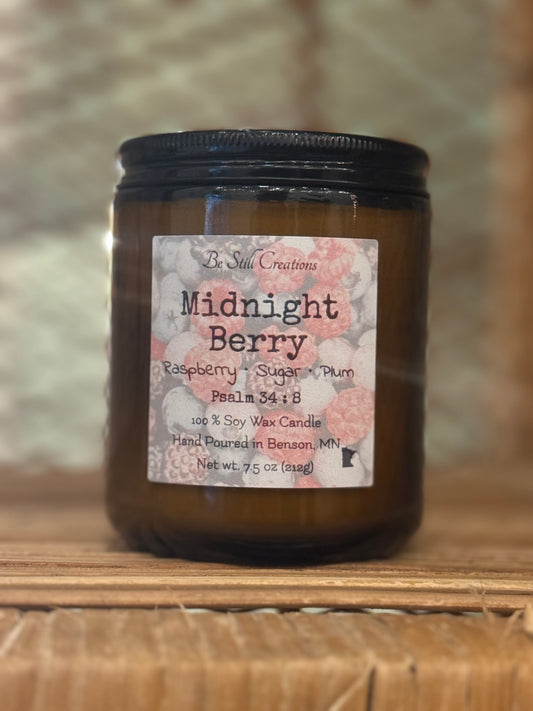 Close-up of Midnight Berry candle label showing raspberry, sugar, and plum fragrance notes