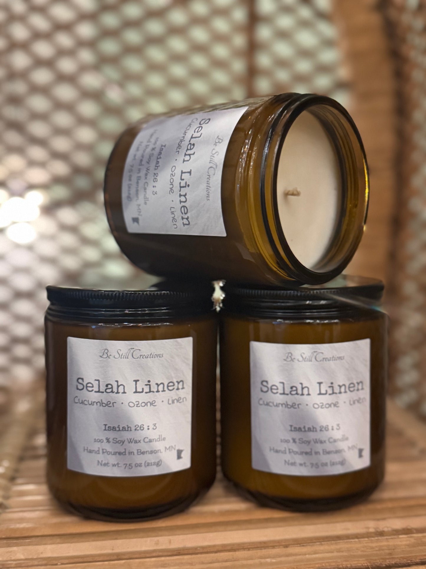 Selah Linen soy candle in clear glass jar with white wax and black lid, cucumber ozone linen scent