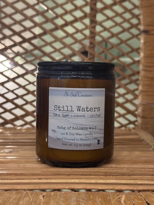 Close-up of Still Waters candle label showing sea salt, ozone, and orchid fragrance notes