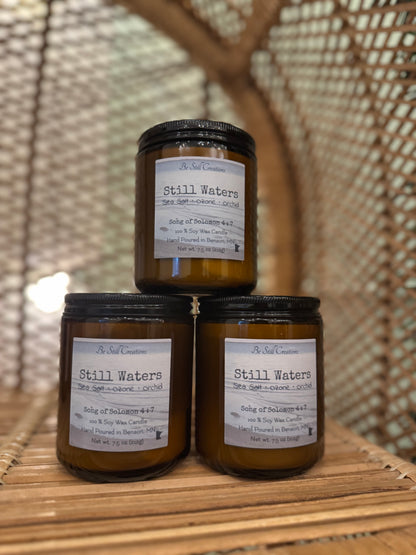 Still Waters candle detail view showing phthalate-free, pet-friendly soy wax formula, 38+ hour burn time