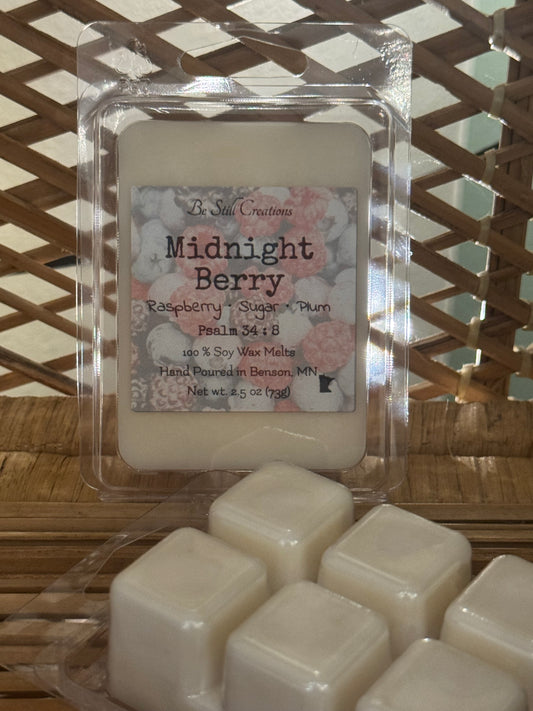 Close-up of Midnight Berry wax melts label showing raspberry, sugar, and plum fragrance notes