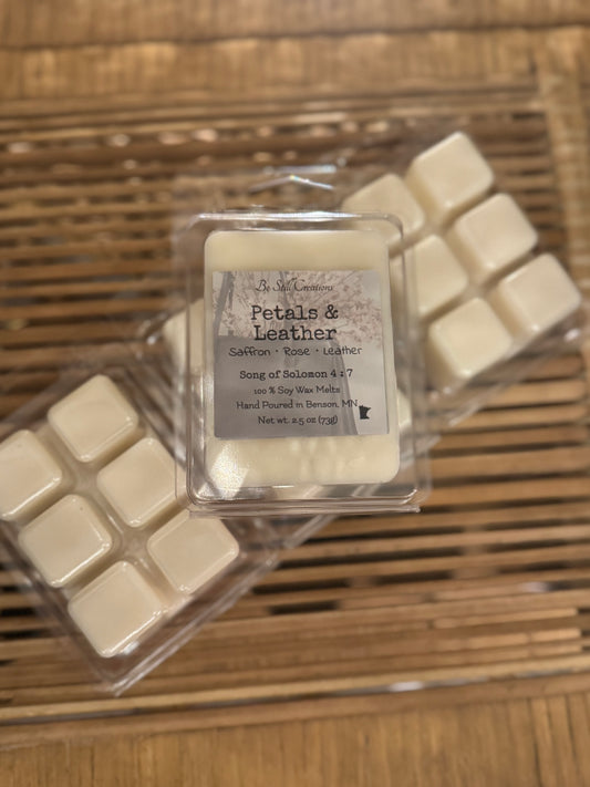 Petals & Leather soy wax melts in clear clamshell package, saffron rose leather scent