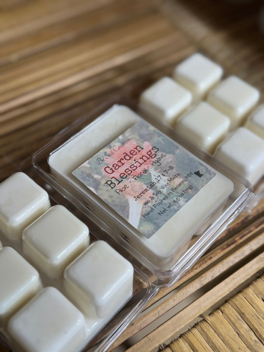 Packaged floral scented soy wax melts with a label on a wooden surface